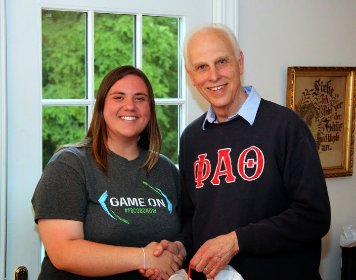 Phi Alpha Theta member Kensie Zills accepts congratulations from Dr. Stephen Carls at the history department's cookout on May 8, 2015, for the successful completion of her Bachelor of Science degree at Union University in May, 2015.
