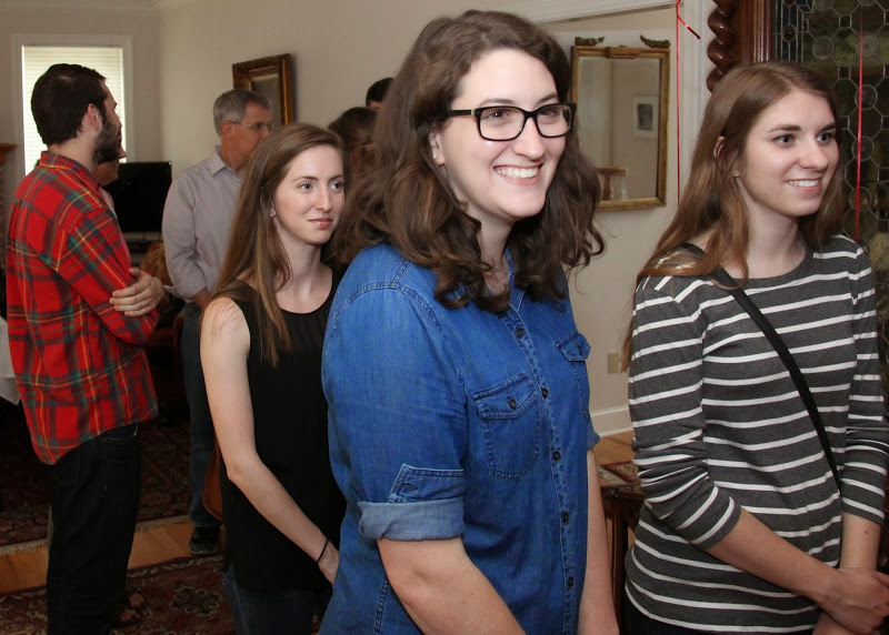 Guests stand in the dinner line at the Phi Alpha Theta cookout on May 8, 2015. They are (foreground, left to right) Mary Ellen Poe (wearing black), Olivia Winters, and Grace Pepper.