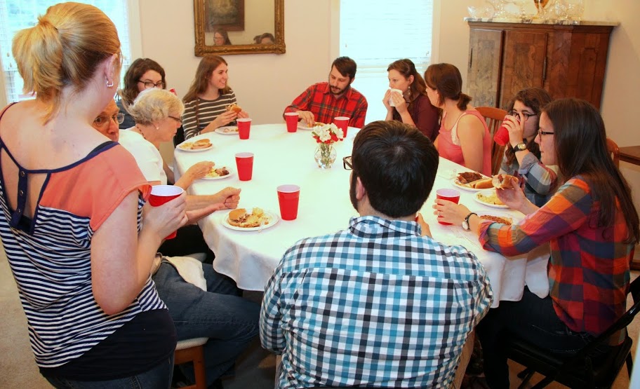 Guests at the 23rd Annual Phi Alpha Theta/History Department Cookout on May 8, 2015, enjoy food and conversation together.