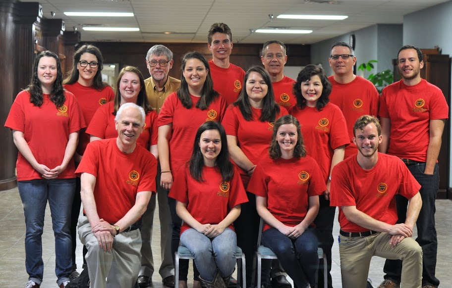 Phi Alpha Theta members join together for a photo during the Delta-Psi chapter's Annual Red T-shirt Spirit Day on April 11, 2015. They are: (front row, left to right) Dr. Stephen Carls, Alexandra Martin, Elizabeth Adams, and Seth Reid; (second row, left to right) Lauren Geary, Kathryn Mitchell, Emily Littleton, Jordan Sellers, and Priscilla Porter; (back row, left to right) Olivia Winters, Dr. Terry Lindley, Stephen Lewoczko, Dr. Henry Allen, Dr. Keith Bates, and Jeremy Ebert. Photo by MiKalla Cotton