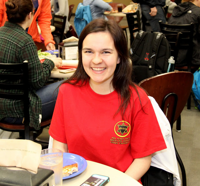 Alexandra Martin takes time out from lunch to pose for a photo during the Delta-Psi chapter's Annual Red T-shirt Spirit Day on April 11, 2016.