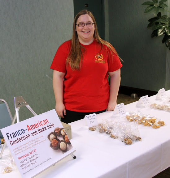 Hannah Conway works as a salesperson at the Franco-American bake sale on April 20, 2016.