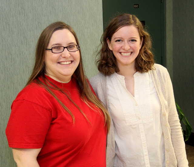 Hannah Conway (left) and Elizabeth Adams enjoy a break in the action at the Phi Alpha Theta bake sale on April 20, 2016. They served as salespersons.