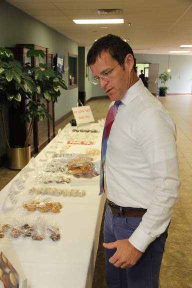 Dr. Phillip Ryan chooses items to buy at the Phi Alpha Theta bake sale on April 20, 2016.
