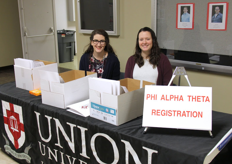 Olivia Winters (left) and Lauren Geary take care of the registration table at the 2016 Phi Alpha Theta Regional Conference at Union University on April 2.