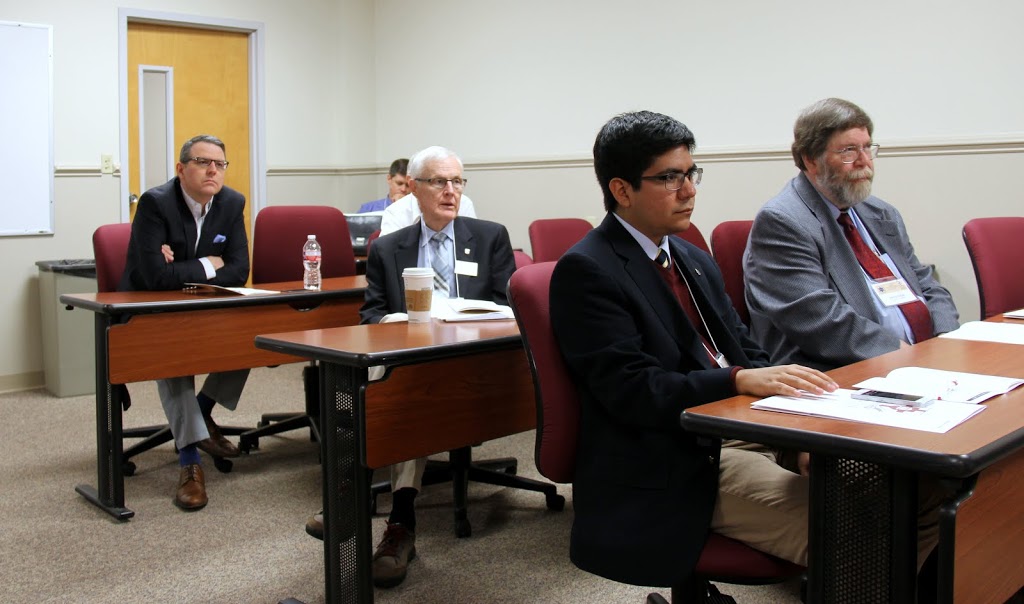 Union's Dr. Keith Bates (left) and Dr. James Patterson (sitting in the row ahead of Bates) attend a panel on The United States from 1860 to 1900: Economics, Railroad Corruption, and Epidemics at the Phi Alpha Theta regional conference on April 2, 2016. Dr. Jerry Gaw of Lipscomb University is seated on the right in the front row.