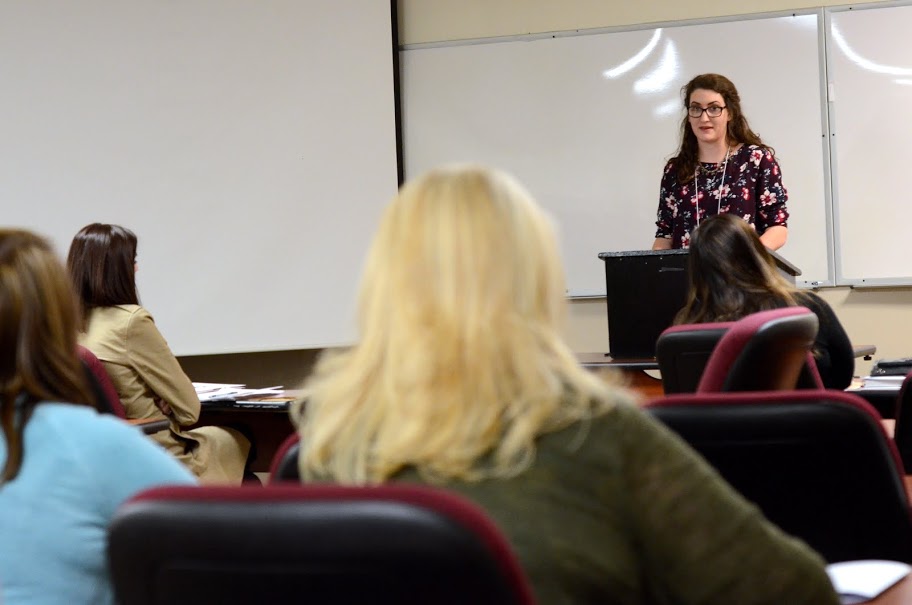 Delta-Psi chapter member Olivia Winters delivers a paper on A Trio of Death: Yellow Fever Epidemics in Memphis for a panel entitled The United States from 1860 to 1900: Economics, Railroad Corruption, and Epidemics at the Phi Alpha Theta regional conference on April 2, 2016. Photo by MiKalla Cotton