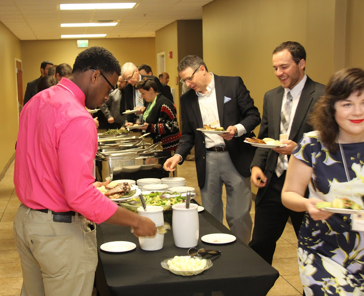 Attendees at the Phi Alpha Theta regional conference on April 2, 2016, go through the food line at the conference luncheon. They are (foreground, left to right) Zachary Lane of Tusculum College, and Dr. Keith Bates, Jeremy Ebert, and Priscilla Porter of Union University.