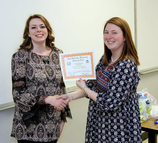 Rutledge Honorary History Club President Kathryn Mitchell (right) congratulates Karina Bogard on becoming a member of the history club on April 5, 2016.