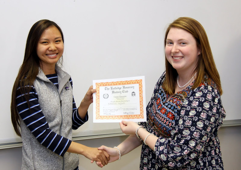 Rutledge Honorary History Club President Kathryn Mitchell (right) congratulates Katherine Cheshire on becoming a member of the club on April 5, 2016.