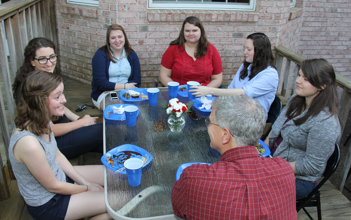 Attendees enjoy a lighthearted conversation at the Phi Alpha Theta/History Department cookout on May 13, 2016. They are (starting on the left, going clockwise) Elizabeth Adams, Olivia Winters, Kathryn Mitchell, Jessica Barton, Lauren Geary, Jordan Sellers, and Dr. David Thomas.