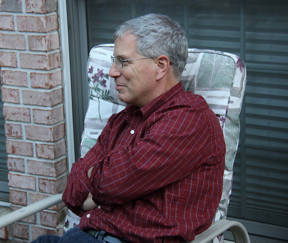 Dr. David Thomas relaxes at the Phi Alpha Theta cookout on May 13, 2016.