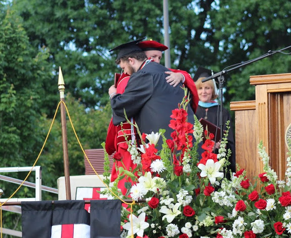 History major Nicholas Hancock receives congratulations from Dr. Samuel W. Dub Oliver after receiving his diploma at Union University's commencement services on May 21, 2016.