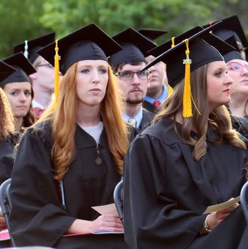 Phi Alpha Theta member Hollie Wilson (front left) listens to Dr. Samuel W. Dub Oliver, Union University's president, welcome attendees to the school's commencement services on May 21, 2016.
