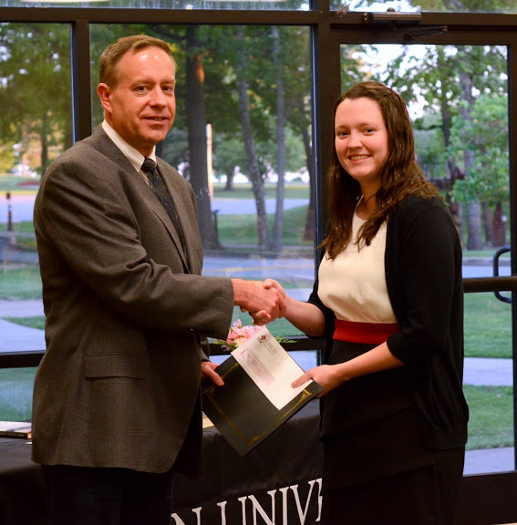 Lauren Geary accepts the second place award in the Dr. James Alex Baggett History Research Paper Competition from Dr. Henry Allen at the history awards banquet on May 5, 2016. Photo by MiKalla Cotton