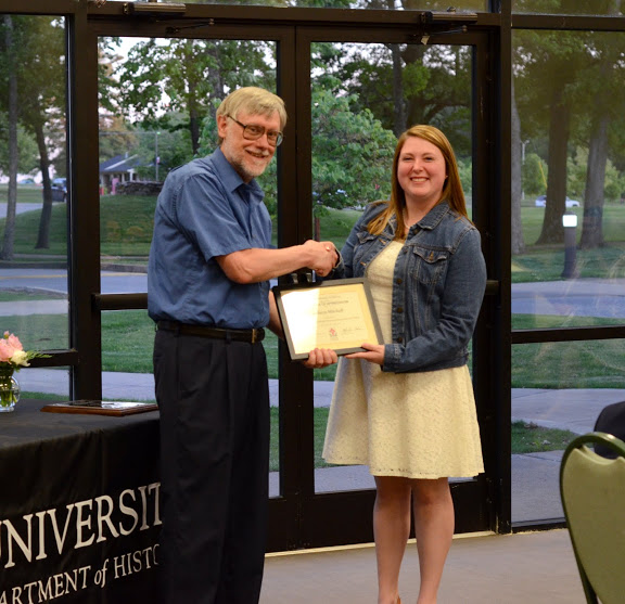 Dr. Lindley congratulates Kathryn Mitchell at the history awards banquet on May 5, 2016, for her work as president of the Rutledge Honorary History Club in 2015-2016. Photo by MiKalla Cotton