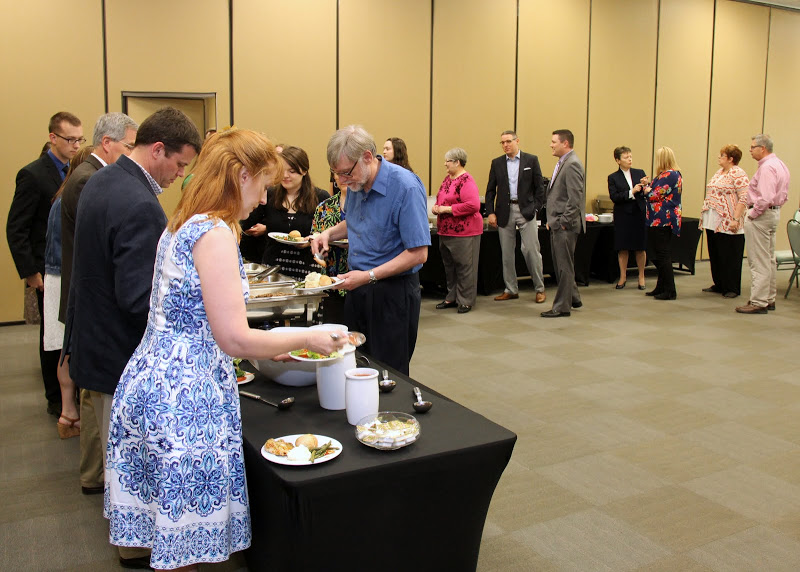 Attendees go through the buffet line at the history awards banquet on May 5, 2016.