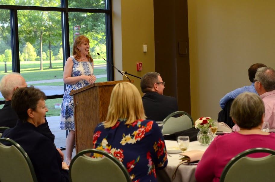 Featured banquet speaker Angie Baker Nichols (standing) and others smile at a comment made during a question and answer session following her talk at the History Department Awards Banquet on May 5, 2016. Photo by Mikassa Cotton