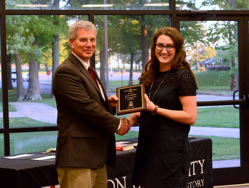 Olivia Winters receives congratulations from Dr. David Thomas at the history awards banquet on May 5, 2016, for winning a History Minor Award. Photo by MiKalla Cotton
