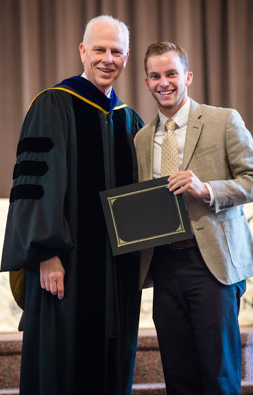 Dr. Stephen Carls (left) presents the first place award in the Dr. James Alex Baggett History Research Paper Competition to Seth Reid at Union University's Annual Awards Convocation on May 6, 2016. Photo by Kristi Woody