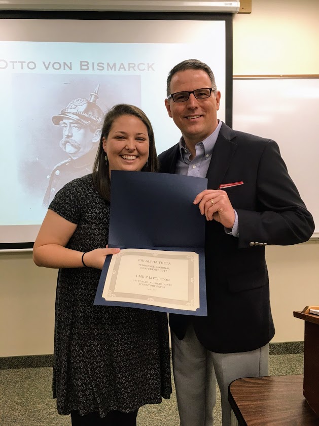 Dr. Keith Bates presents to Emily Littleton on April 3, 2017, the second place certificate in the American history category that she won at the Tennessee Phi Alpha Theta Regional Conference on April 1. Littleton was unable to attend the awards ceremony at the conference.