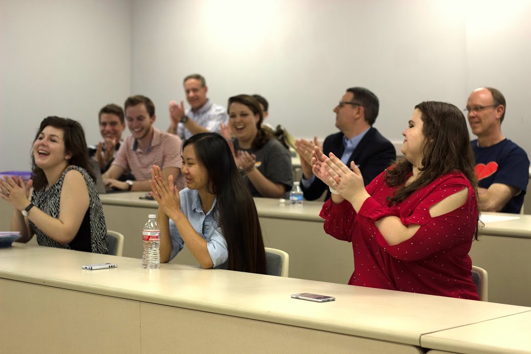 Phi Alpha Theta members celebrate Katherine Cheshire's election as vice president of the Delta-Psi chapter for 2017-2018 during the society's plenary meeting on February 20, 2017. She is in the middle of the front row, with Priscella Porter on the left and Jessica Barton on the right. Photo by Morgan Morfe