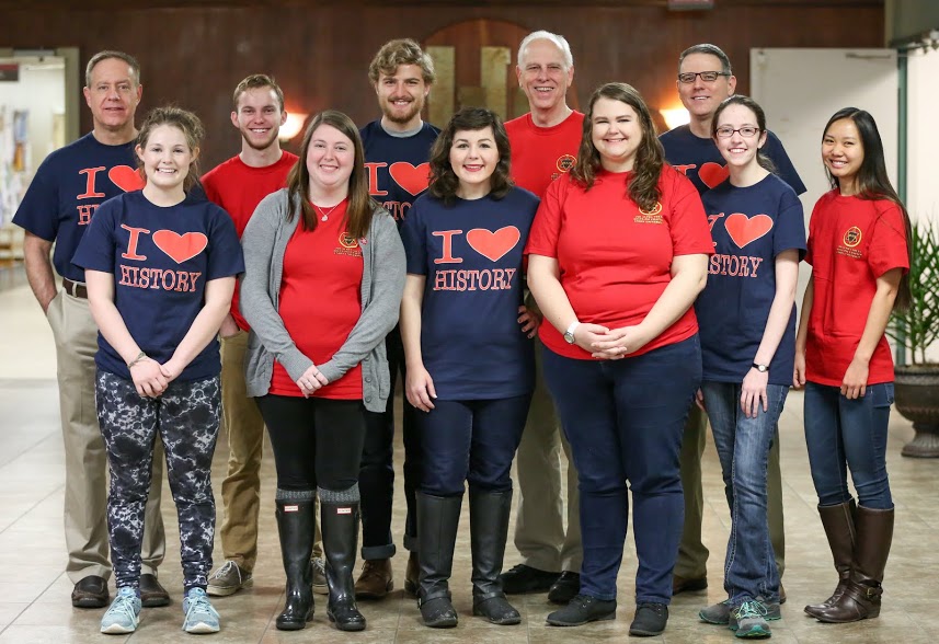 History faculty members and students join together for a photo on Phi Alpha Theta's T-shirt-wearing History Spirit Day on March 13, 2017. They are: (front row, left to right) Alexandria Barger, Kathryn Mitchell, Priscilla Porter, Jessica Barton, Lauren Butler, and Katherine Cheshire; (back row, left to right) Dr. Henry Allen, Seth Reid, Luke Sower, Dr. Stephen Carls, and Dr. Keith Bates. Photo by Kristi Woody