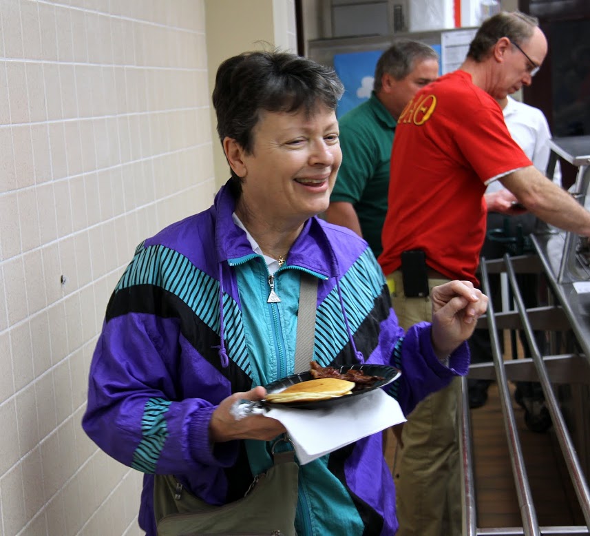 Dr. Alice-Catherine Carls smiles as she goes through the food line at the Jackson Old Hickory Rotary Club Pancake Breakfast on March 18, 2017.