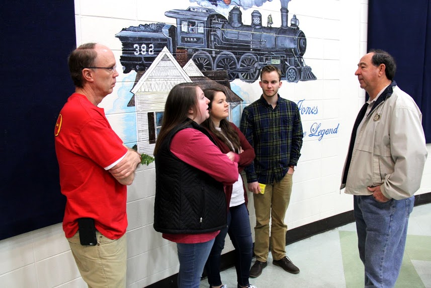 Phi Alpha Theta members talk to Rotarian Glen Vanderford (right) at the Jackson Old Hickory Rotary Club pancake breakfast on March 18, 2017. The Delta-Psi chapter members are (left to right) Robert Briley, Kathryn Mitchell, Jordan Sellers, and Seth Reid.