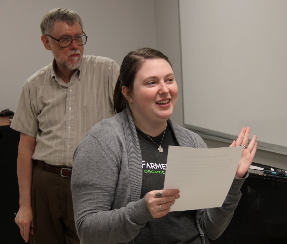 History Club President Kathryn Mitchell leads the induction ceremony for new members at the club's spring plenary meeting on March 27, 2017. Dr. Terry Lindley stands behind her.