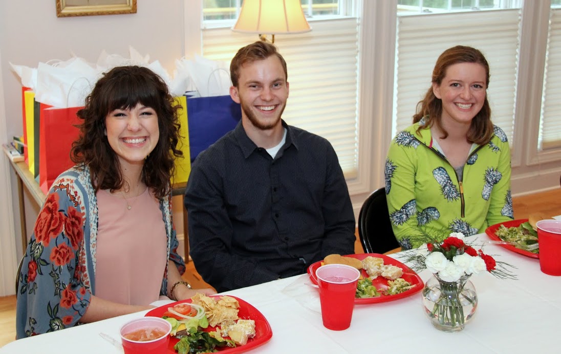 Kaylee Gibson (left to right), Seth Reid, and Beth Adams enjoy their meals together at the Phi Alpha Theta cookout on May 12, 2017.