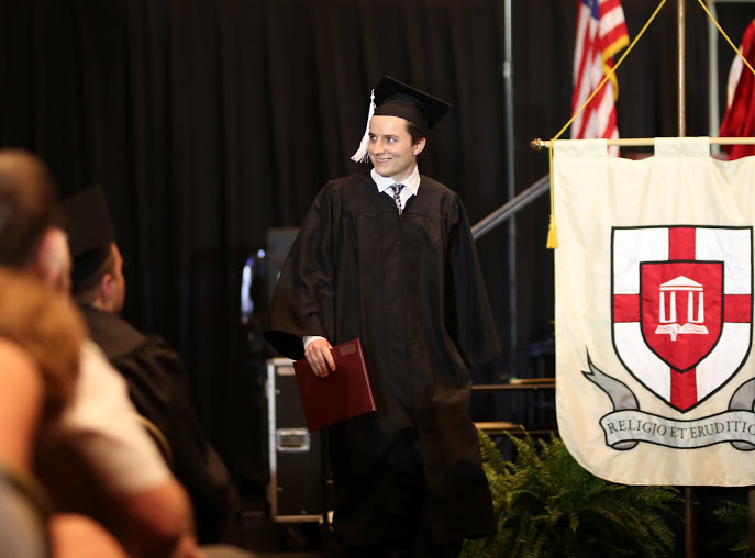 History major Nic Linn shows delight after receiving his diploma at Union University's commencement services on May 20, 2017. Photo by Kristi Woody