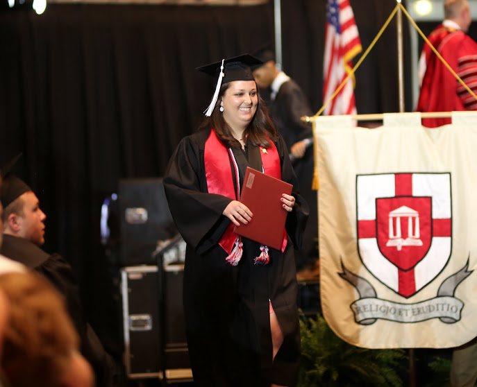 Emily Littleton is delighted after receiving her diploma at Union University's graduation exercises on May 20, 2017. Photo by Kristi Woody