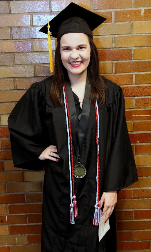 Graduating Phi Alpha Theta member Alex Martin takes time for a photo while waiting for the processional to begin at Union University's spring commencement on May 20, 2017.