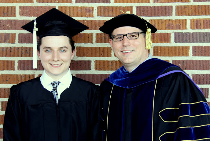 Graduating history major Nic Linn (left) stands with Dr. Keith Bates prior to Union University's spring commencement exercises on May 20, 2017.