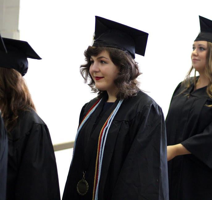 Phi Alpha Theta member Priscilla Porter participates in the processional at Union University's commencement services on May 20, 2017. Photo by Kristi Woody