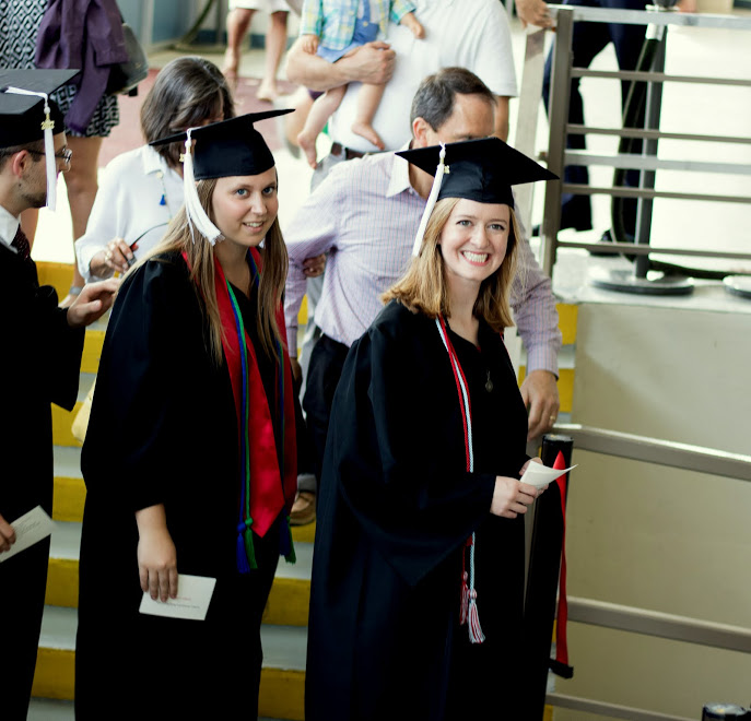 History/English major Beth Adams (right) enters the Oman Arena auditorium during the processional at Union University' graduation exercises on May 20, 2017. Photo by Janelle Vest