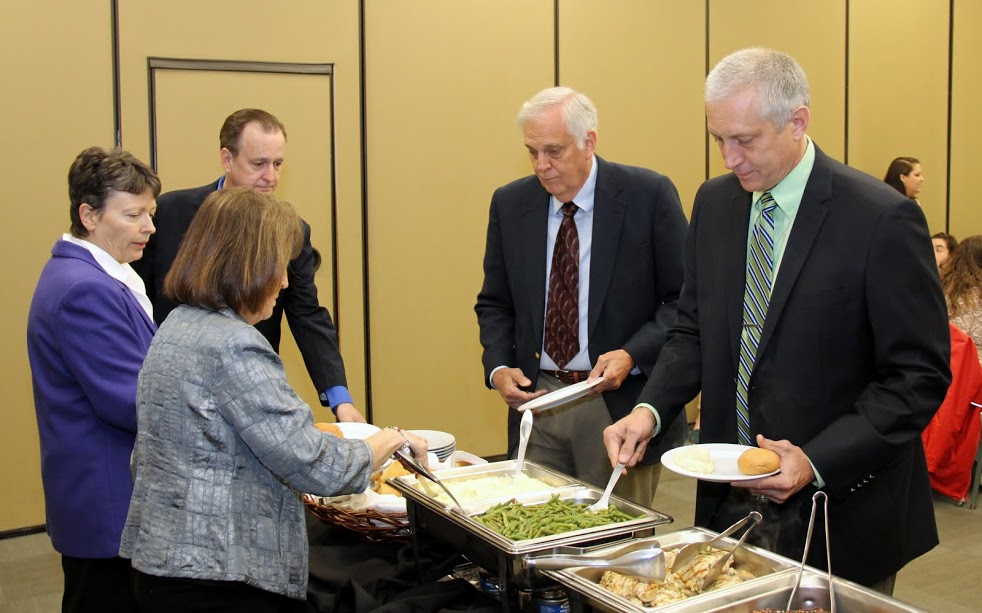 Attendees at the History Department Awards Banquet on May 4, 2017, go through the food serving line. They are (starting on the front left and going clockwise) Louise Rudesill, Dr. Alice-Catherine Carls, Mike Johnson, Dan Rudesill, and Rick Rudesill.