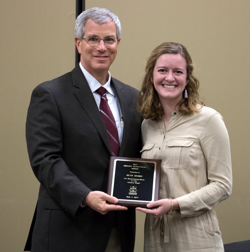 Beth Adams accepts the History Major Award from Dr. David Thomas at the history awards banquet on May 4, 2017. Photo by Janelle Vest