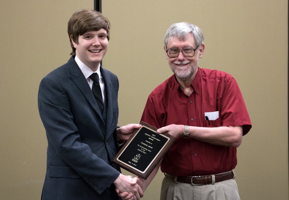 Dr. Terry Lindley (right) presents the History Minor Award to Thomas Gray at the history awards banquet on May 4, 2017. Photo by Janelle Vest