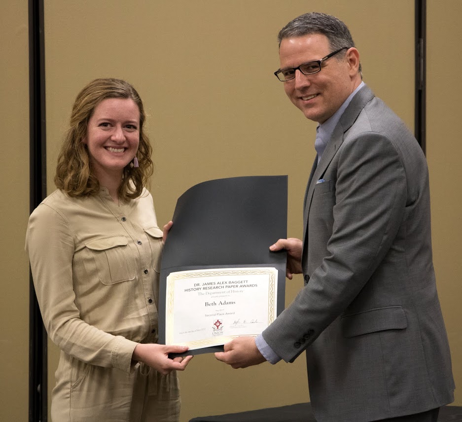 Dr. Keith Bates presents the second place award in the Dr. James Alex Baggett History Research Paper Competition to Beth Adams at the history awards banquet on May 4, 2017. Photo by Janelle Vest