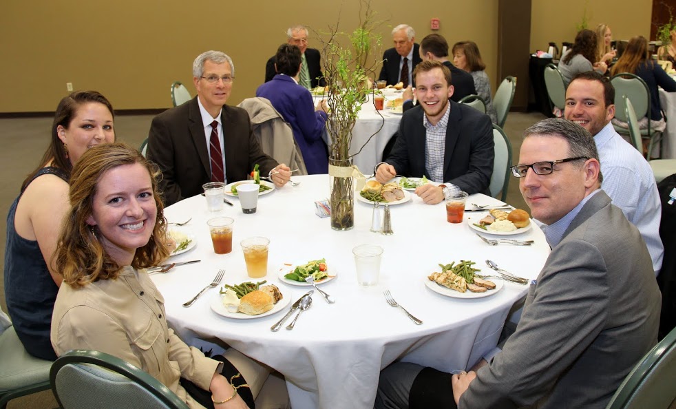 Attendees at the History Department Awards Banquet on May 4, 2017, prepare to enjoy their dinners. They are (starting on the front left and going clockwise) Beth Adams, Emily Littleton, Dr. David Thomas, Seth Reid, Jeremy Ebert, and Dr. Keith Bates.