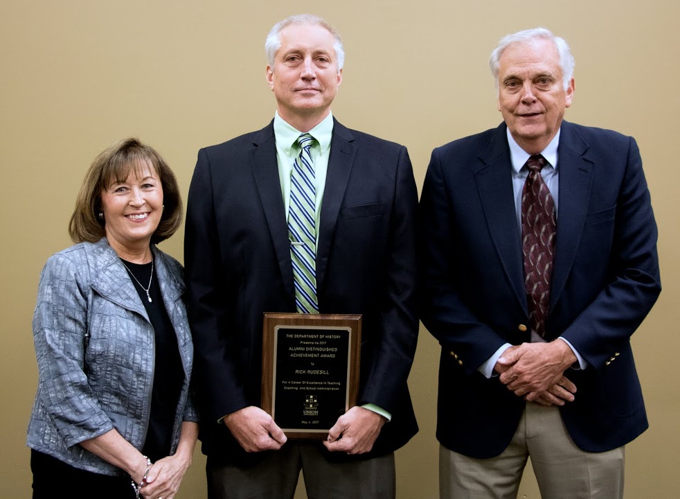 Rick Rudesill (center), the 2017 recipient of the History Alumni Distinguished Achievement Award, stands with his parents, Dan and Louise Rudesill, following the History Department Awards Banquet on May 4, 2017. Photo by Janelle Vest