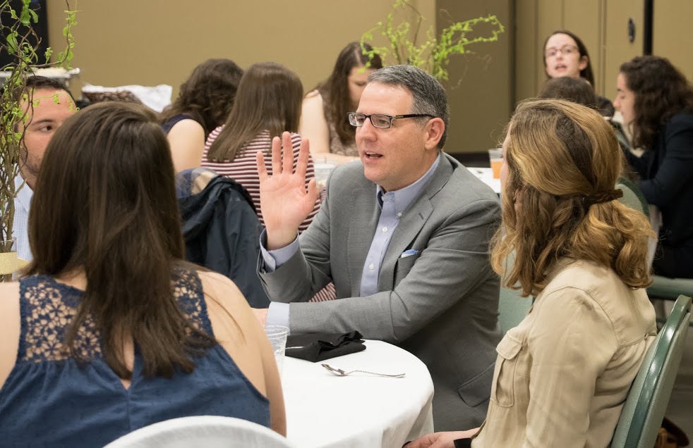 Dr. Keith Bates makes a point during a table conversation at the history awards banquet on May 4, 2017. Photo by Janelle Vest