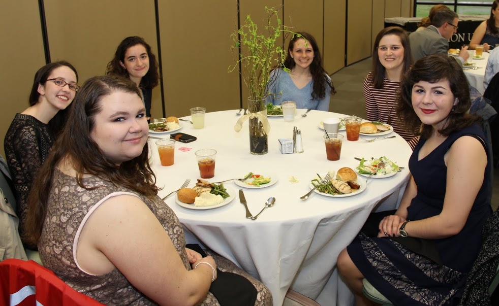 Guests at the history awards banquet on May 4, 2017, pause for a photo before beginning their meals. They are (starting at the front left and going clockwise) Jessica Barton, Lauren Butler, Leah Atkins, Katie Allison, Haley Hathcock, and Priscilla Porter.