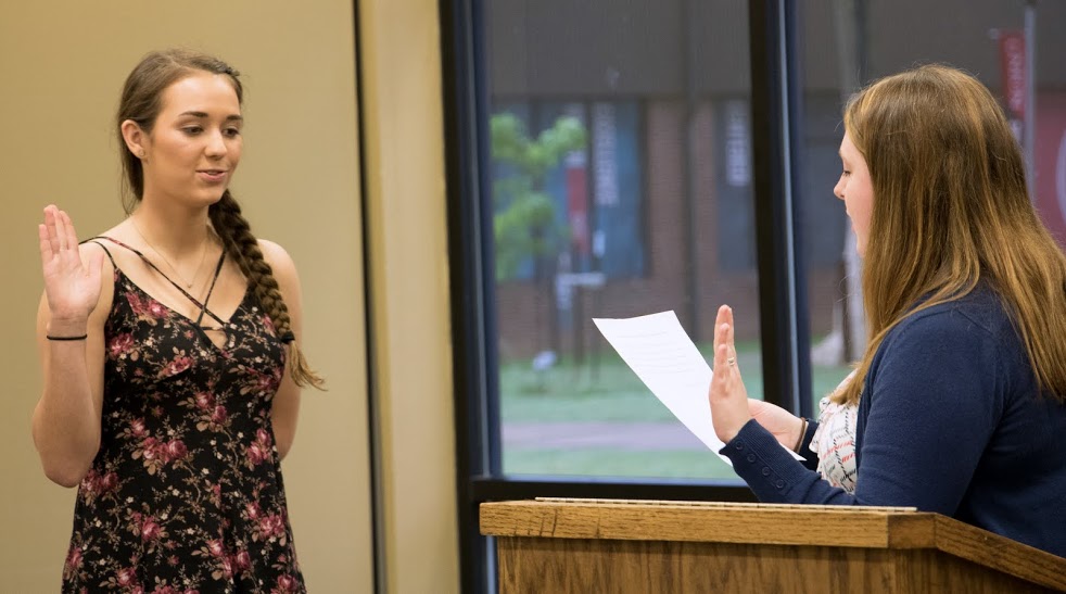 Rutledge Honorary History Club President Kathryn Mitchell (right) inducts Anna Cook into the club during the History Department Awards Banquet on May 4, 2017. Photo by Janelle Vest