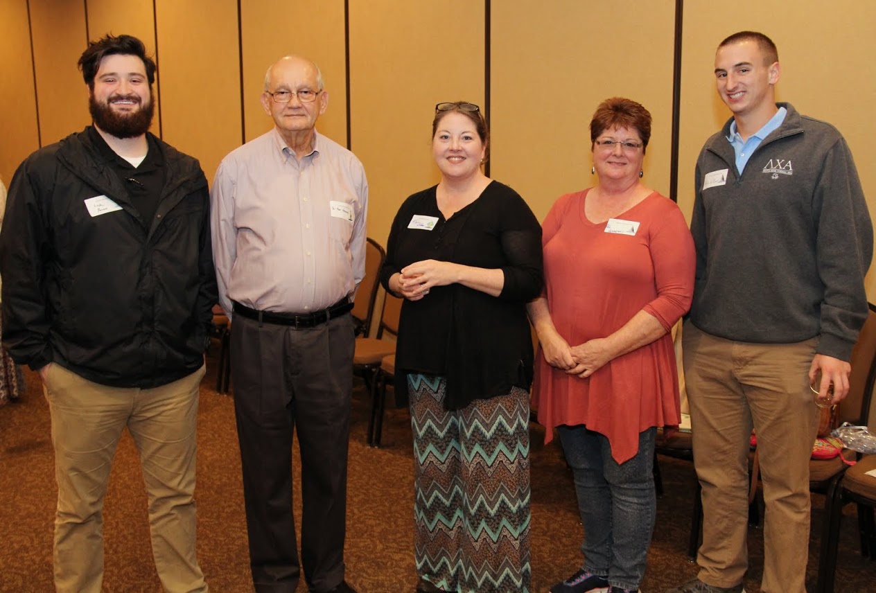 History major Luke Parrett (left to right), Union's Dr. Ken Newman, Northeast Middle School teachers Kimberly Dilden and Patricia Hennessy, and history major Jeff Williams stand together at the Teacher Appreciation Tea that Union University's Educator Preparation Program and Union's chapter of the Student Tennessee Education Association sponsored on May 4, 2017.