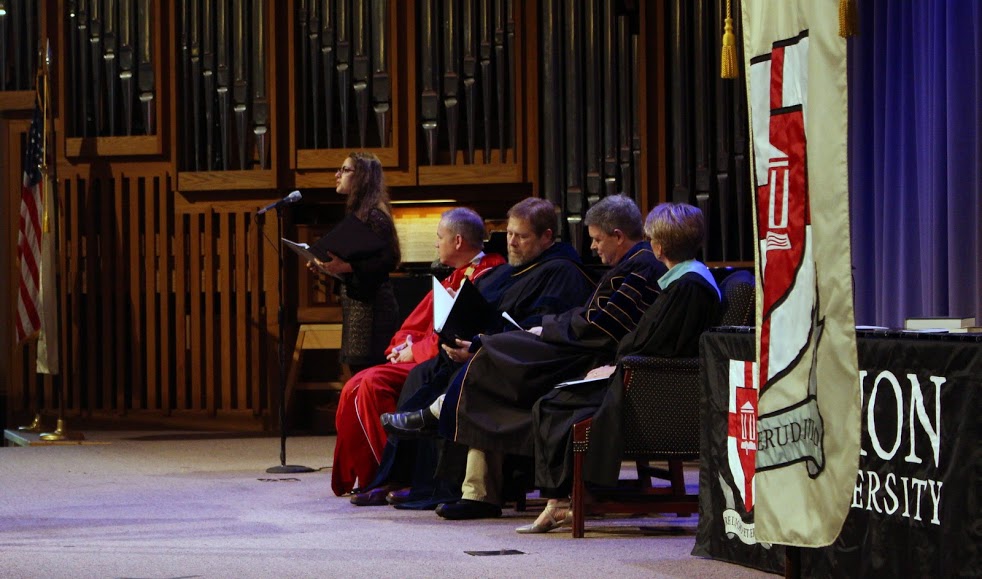 Paula Nesticó performs a vocal solo at the Union University Awards Day Convocation on May 5, 2017. Seated in the foreground are (left to right) Union University President Samuel W. Dub Oliver, Provost Ben Mitchell, Faculty of the Year Webb Drake, and Registrar Susan Hopper. Photo by Kristi Woody