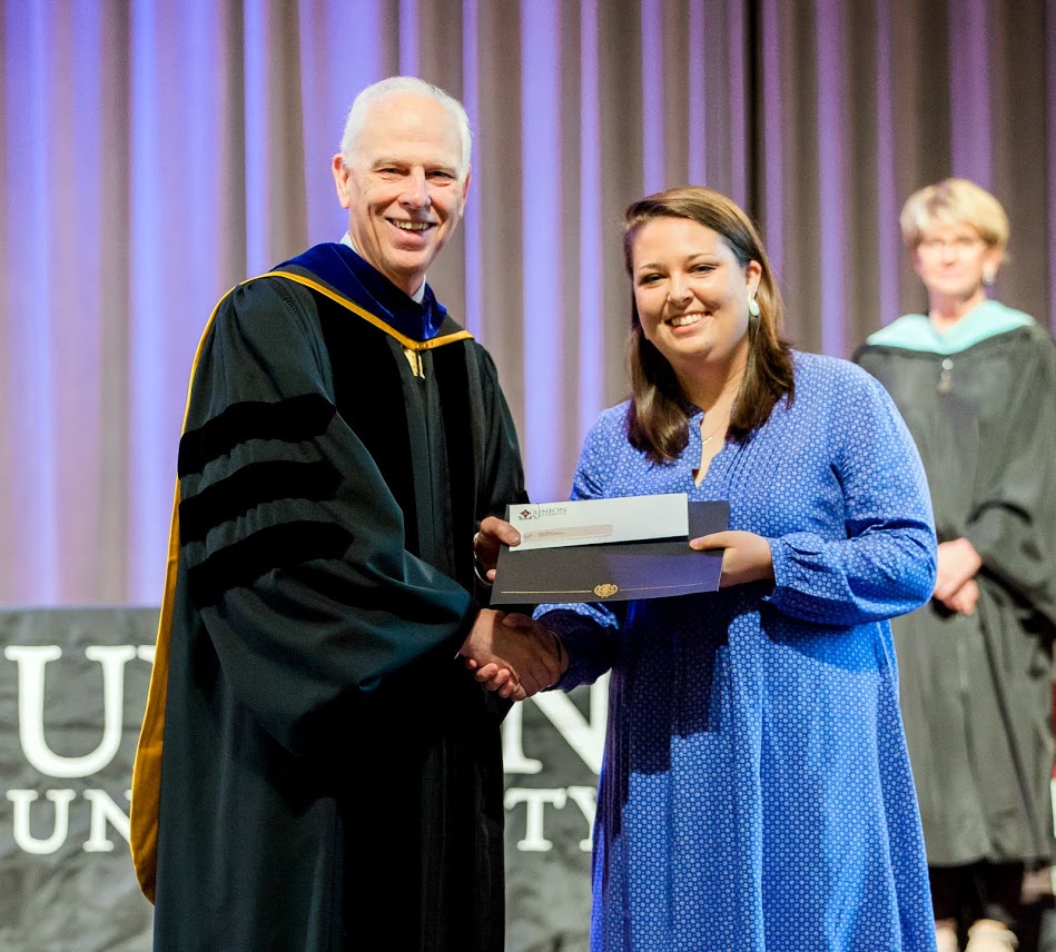 Dr. Stephen Carls presents the first place award in the Dr. James Alex Baggett History Research Paper Competition to Emily Littleton at the Union University Awards Day Convocation on May 5, 2017. Photo by Kristi Woody