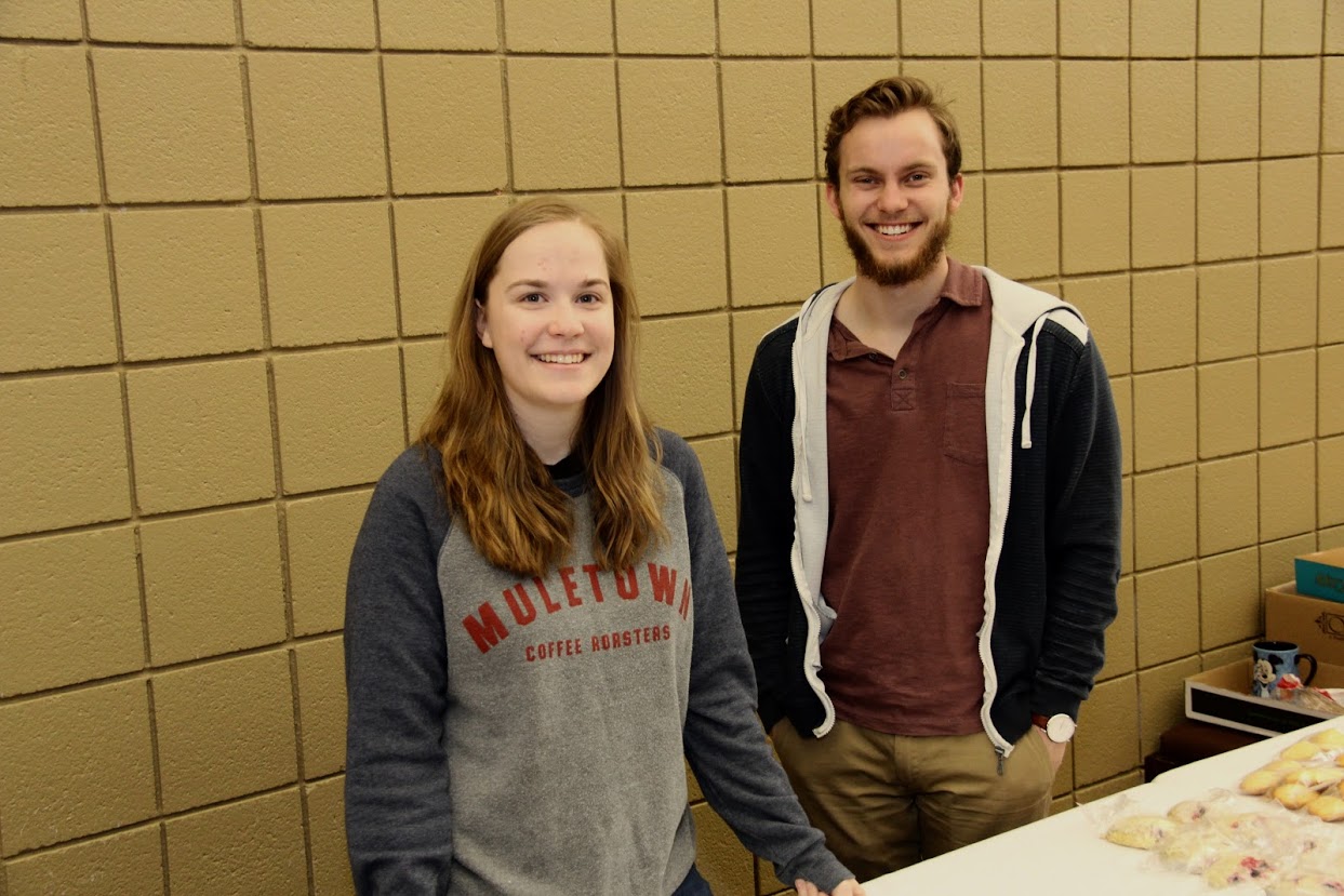 Megan Ledbetter and Seth Reid smile for the camera during a break in the Phi Alpha Theta bake sale on April 11, 2018.